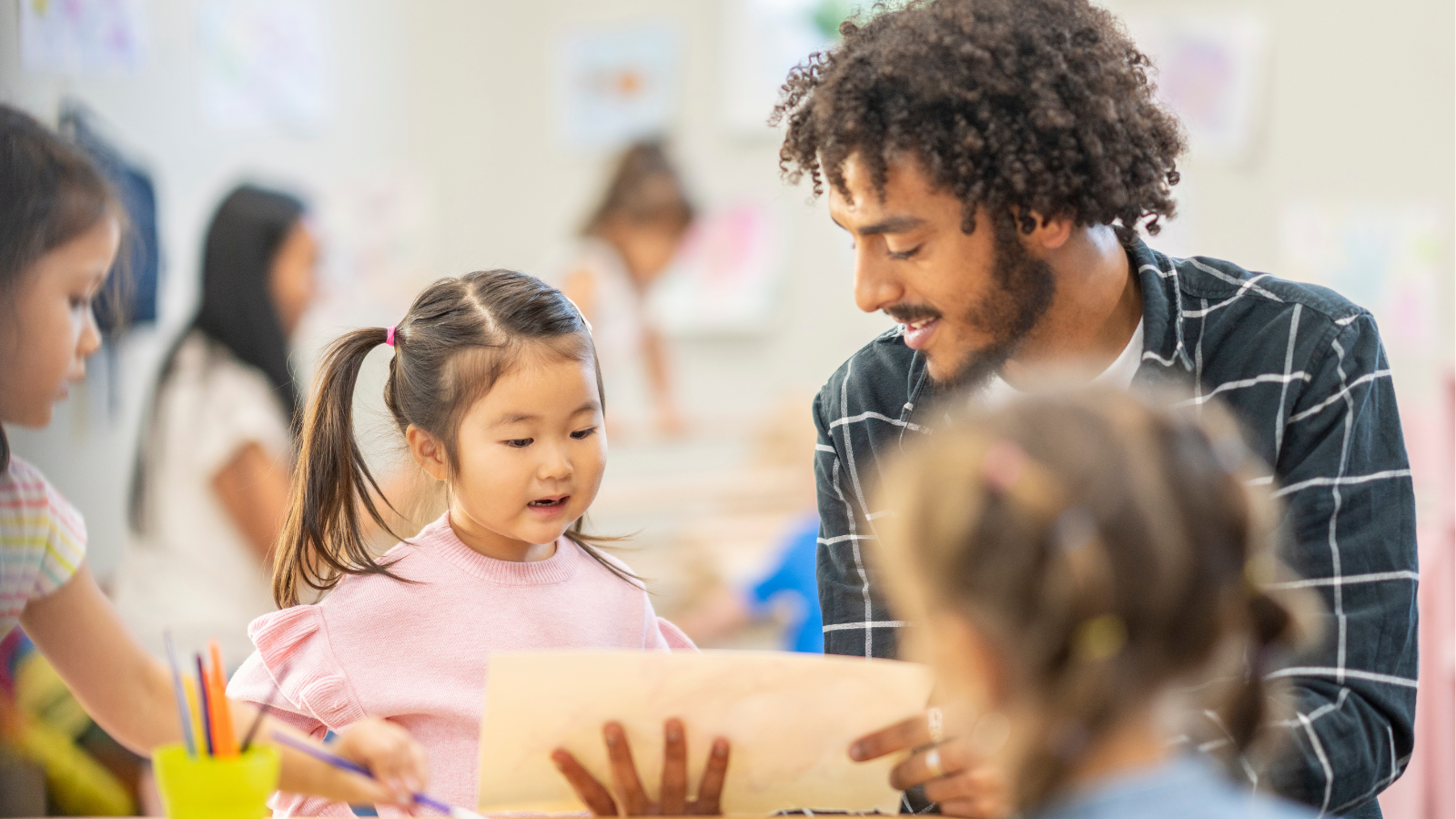 Student reading to teacher 