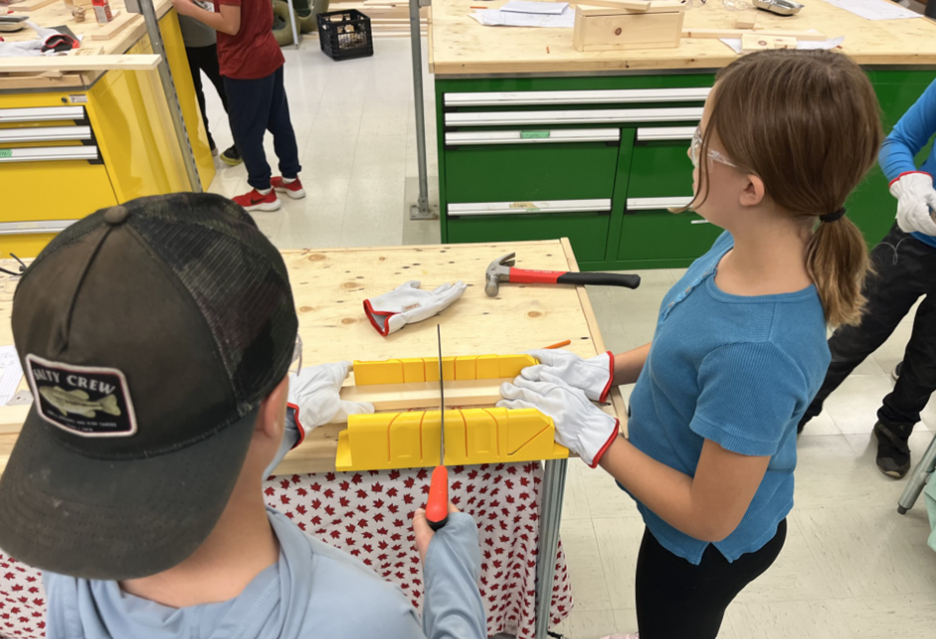 Two students working on a woodshop project
