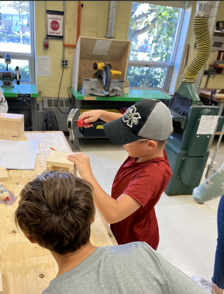 Two students working in a woodshop class